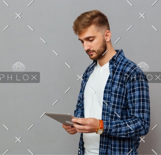 demo-attachment-37-portrait-of-a-man-using-tablet-computer-PCDLD3R